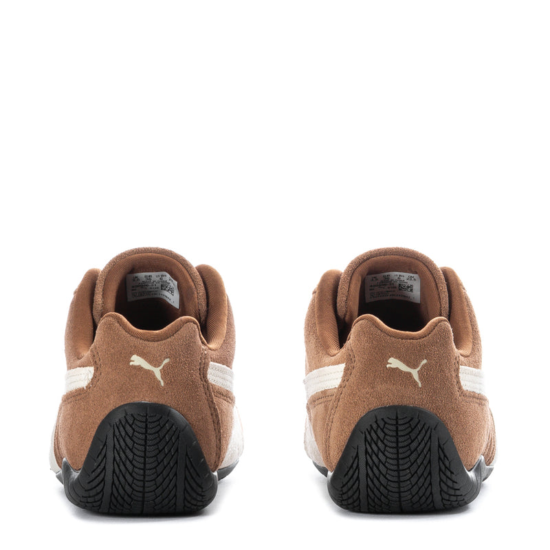Brown suede sneakers heel and collar view with PUMA cat logo