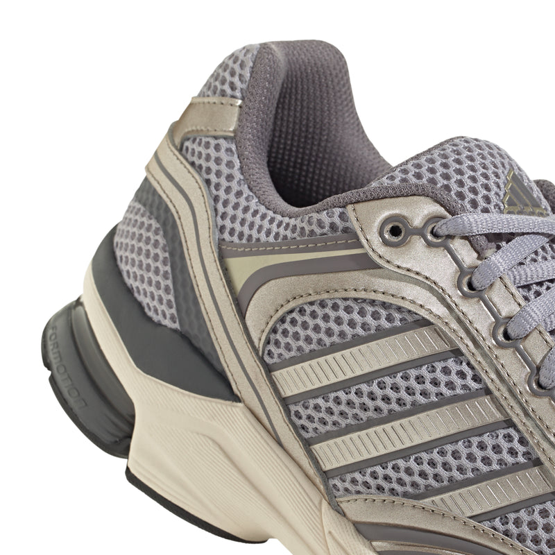 Men's sneaker upper close-up: gray perforated mesh with lace and taupe overlays