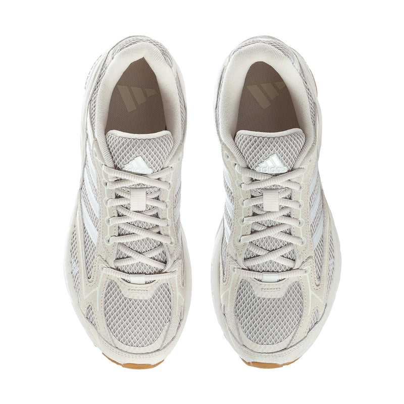 Pair of women's lace-up sneakers in white mesh with padded collar and gum-brown outsole