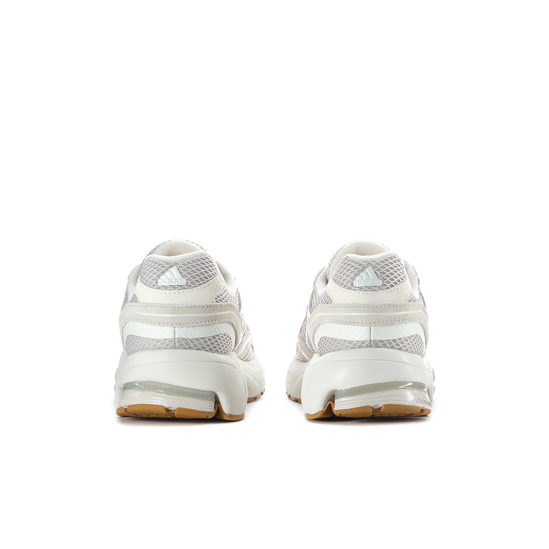 Women's sneakers back view in white with gray stripes, cushioned heel and gum sole