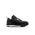 Kids black low-top sneakers with white logo accents, hook-and-loop strap, lace-up