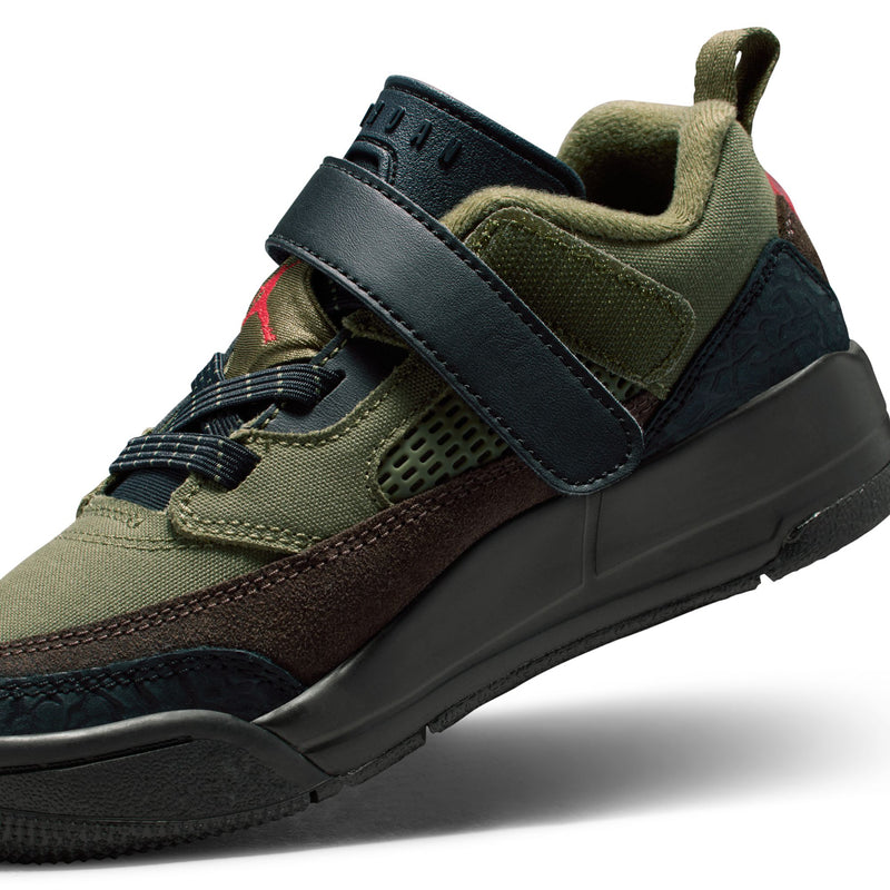 Kids low-top sneaker angled side view with olive upper, black strap, brown trim