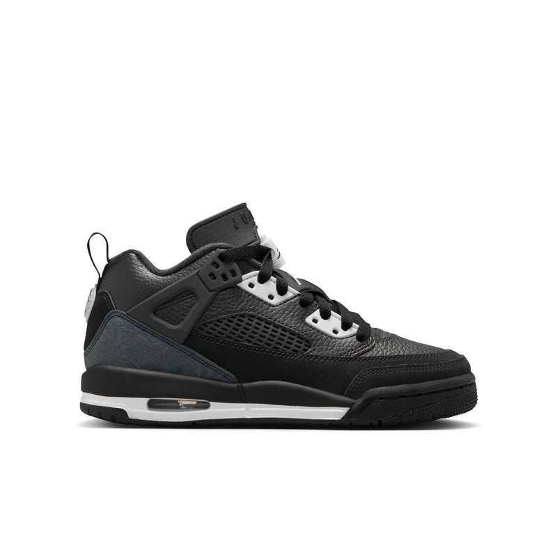 Youth low-top sneakers in black, with perforated panels and white lace eyelets