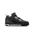 Youth low-top sneakers in black, with perforated panels and white lace eyelets
