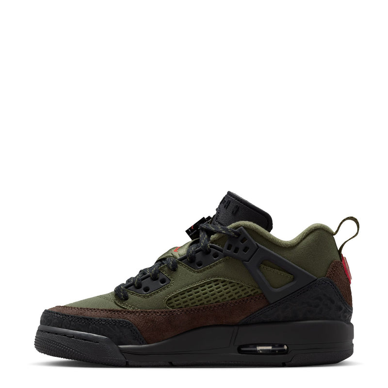 Youth low-top sneakers, olive green upper with dark brown panels, black sole, red details.
