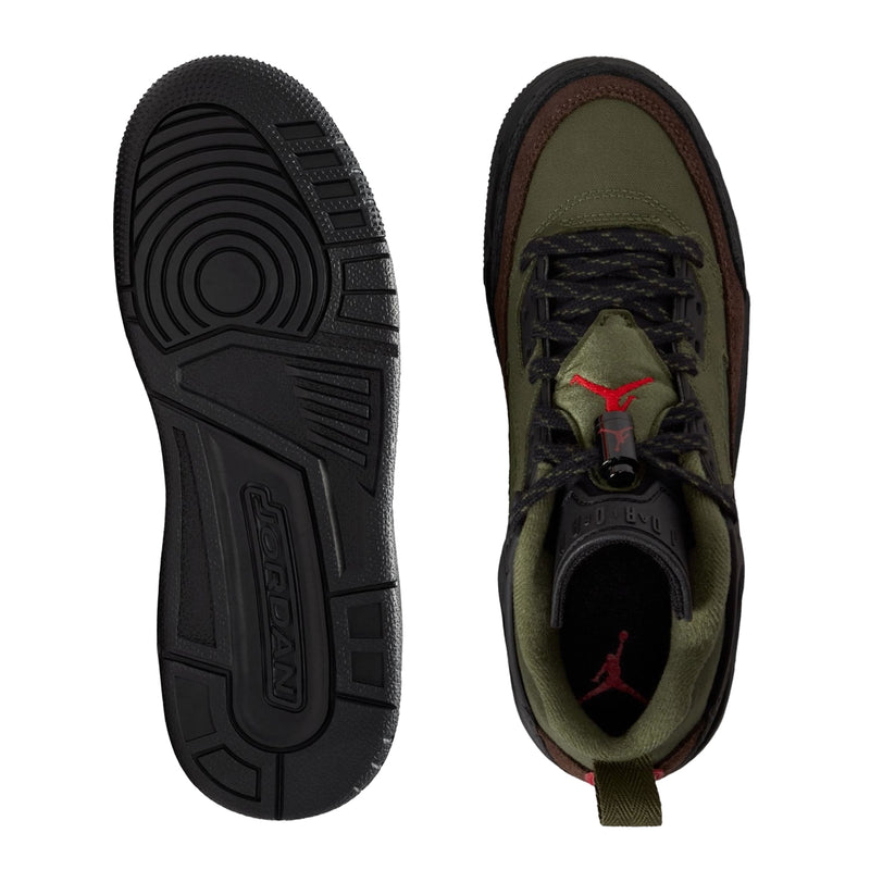 Youth sneakers underside and inner sole view, showing black outsole tread and green lining.