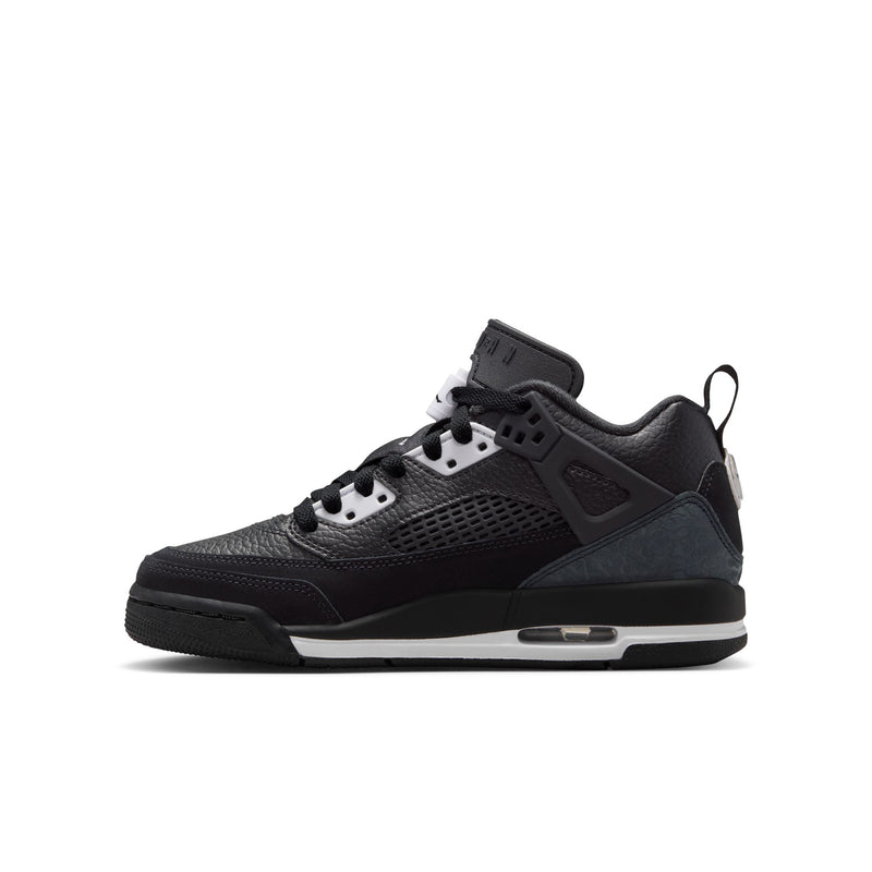 Youth low-top sneakers in black with gray overlays, white eyelets, and lace loops