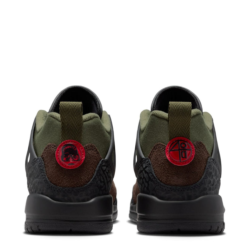 Youth sneakers heel view: olive lining, dark brown suede, black heel, red logo tab.