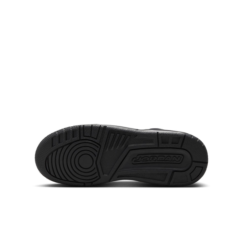 Black youth sneaker outsole with textured tread and Jordan logo