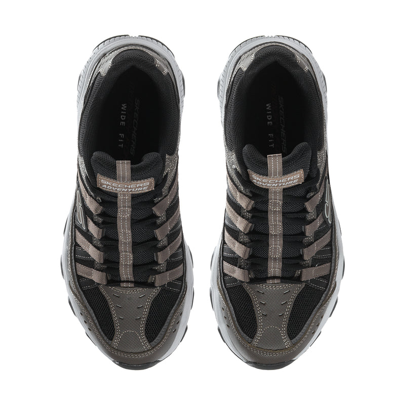 Men's wide athletic sneaker in brown and black, front view with lace-up and padded tongue
