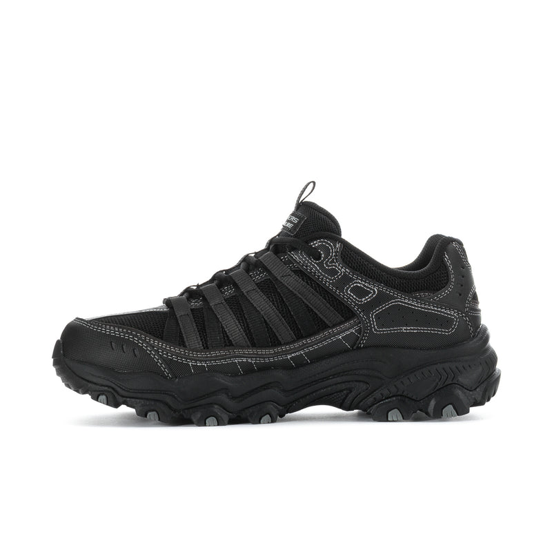 Men's black lace-up trail sneakers with bold midsole and side overlay panels