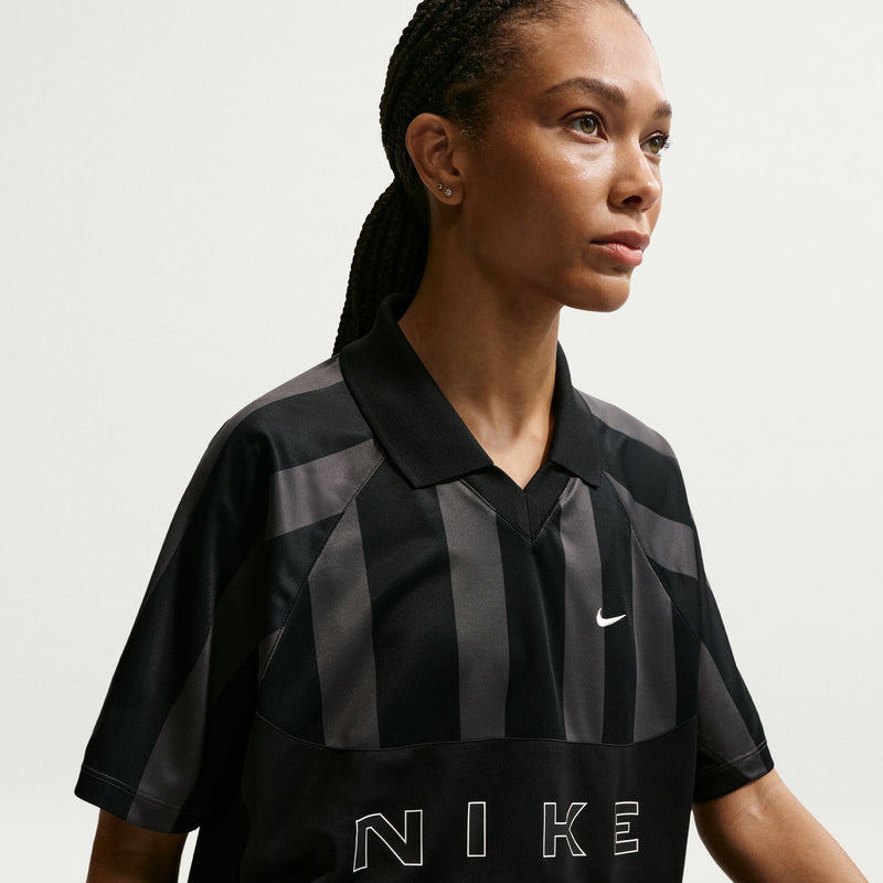 Women’s black striped jersey polo with Nike swoosh and NIKE logo across chest