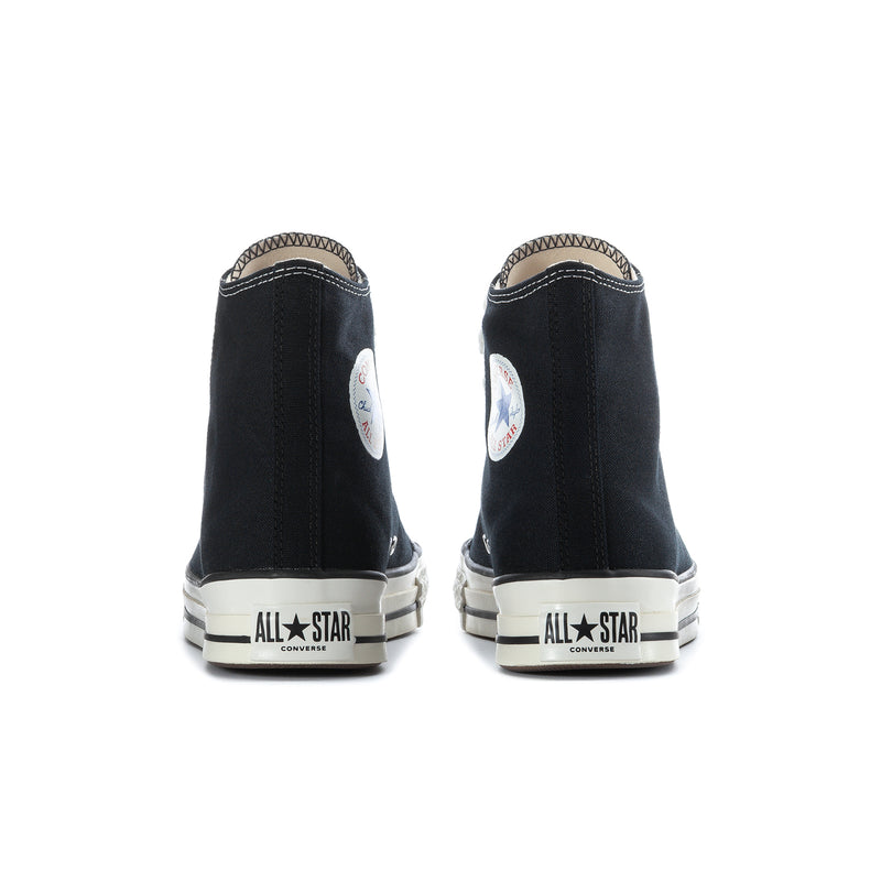 Black high-top sneakers with All Star heel tab and white rubber bumper