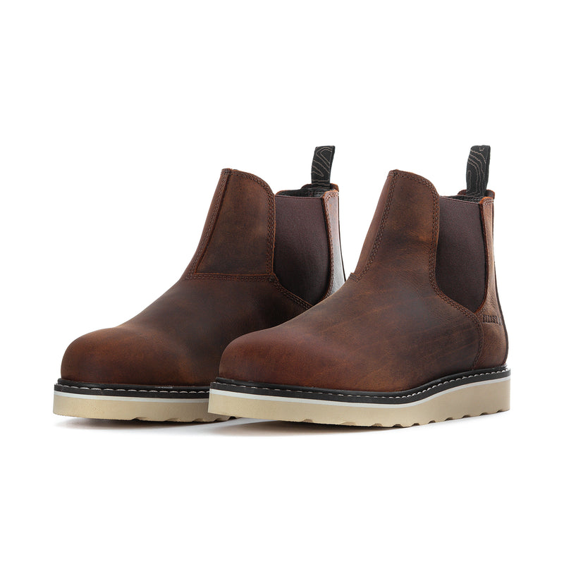 Brown ankle chelsea boots pair with black elastic gore and light textured sole