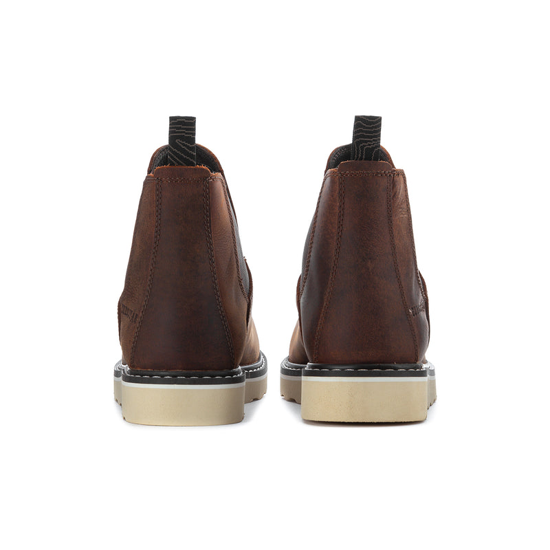 Brown ankle chelsea boots with rear pull tabs and light outsole