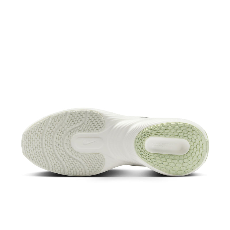 Men's sneaker outsole view, textured tread with light sail and green rubber