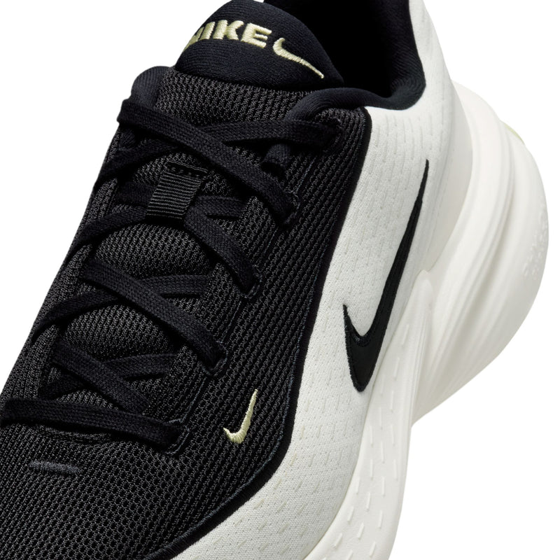 Men's sneaker upper detail, black mesh with lime logo on tongue and sail overlay