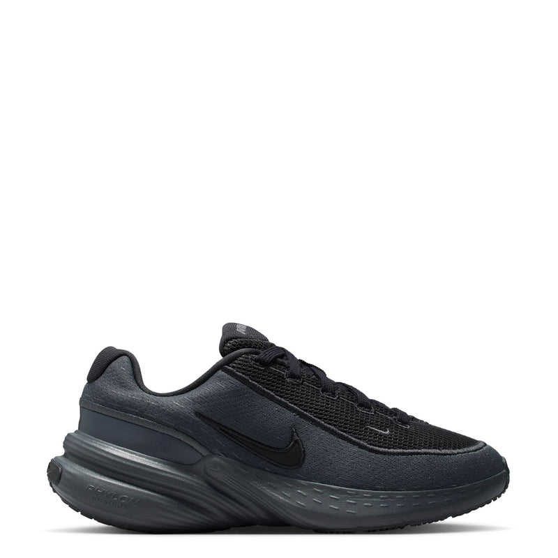 Youth dark running shoe with lace-up mesh upper and swoosh on the side
