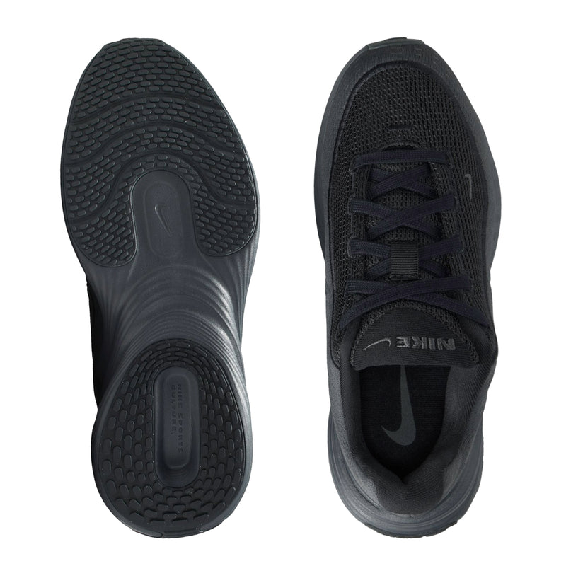 Youth dark shoe outsoles and inner side showing tread pattern and heel cushioning