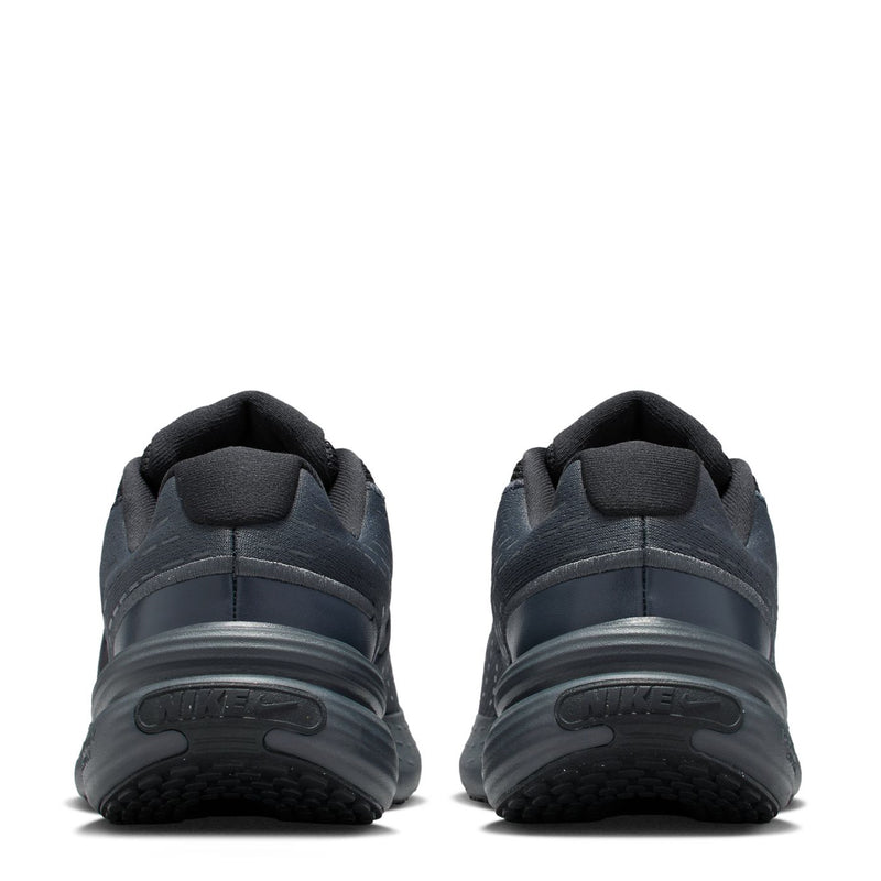 Youth dark sneakers heel view with cushioned collar and layered midsole