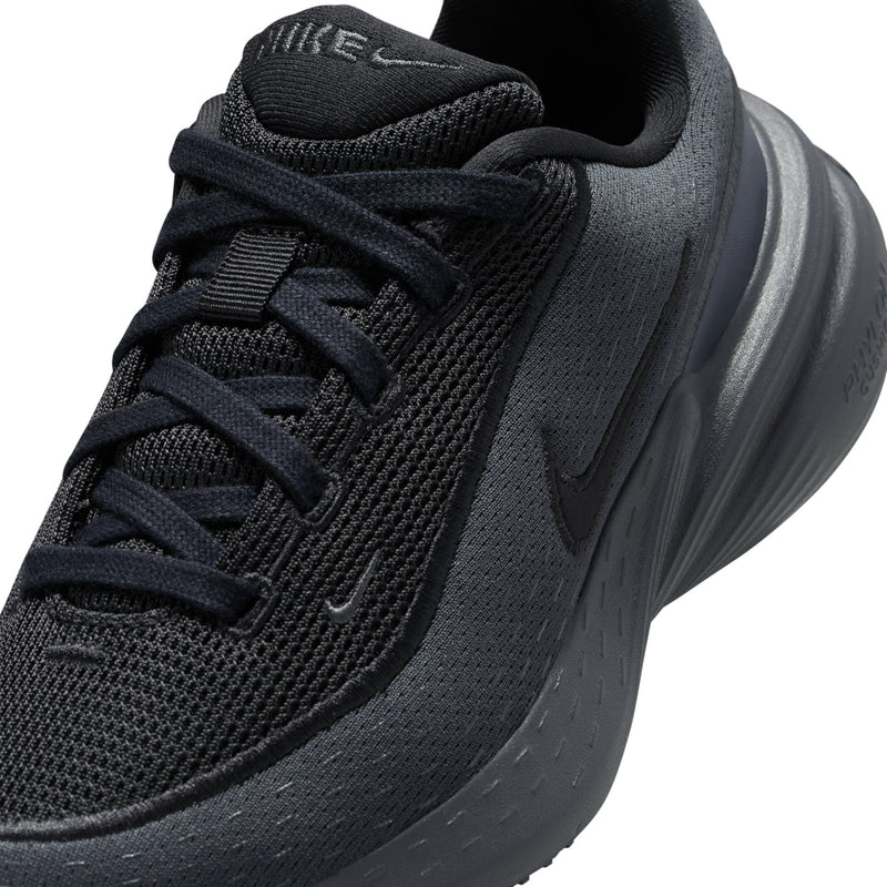 Youth dark mesh upper close-up with lace-up detail and swoosh