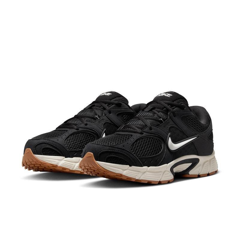 Men's black Nike running shoes angled view with laces and cushioned midsole