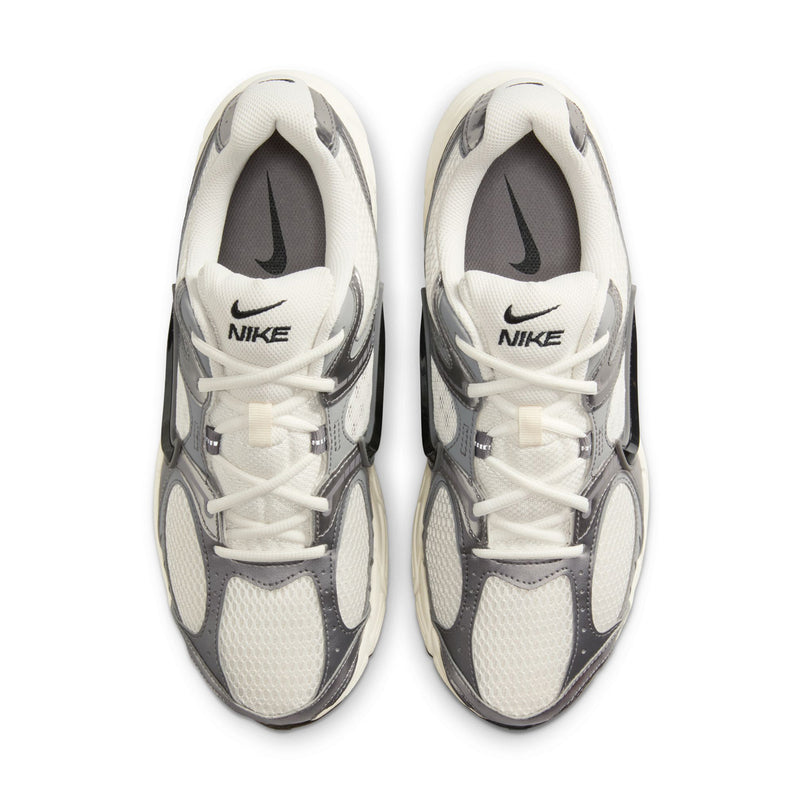 Men's athletic sneaker front view, white laces, Nike logo on the tongue