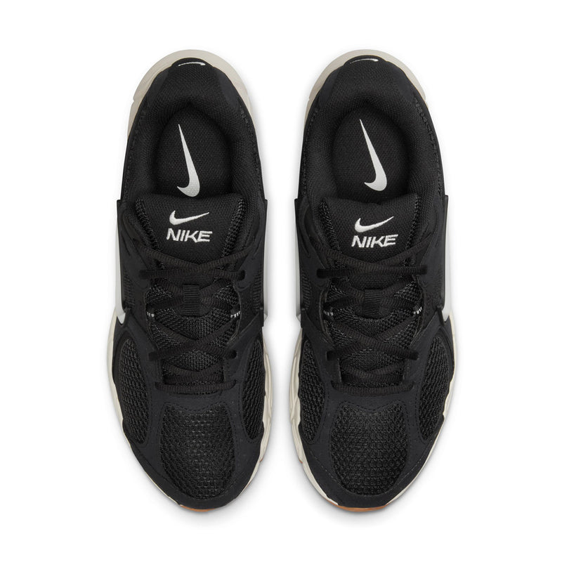 Men's black Nike running shoes, top view of tongues with Nike logo