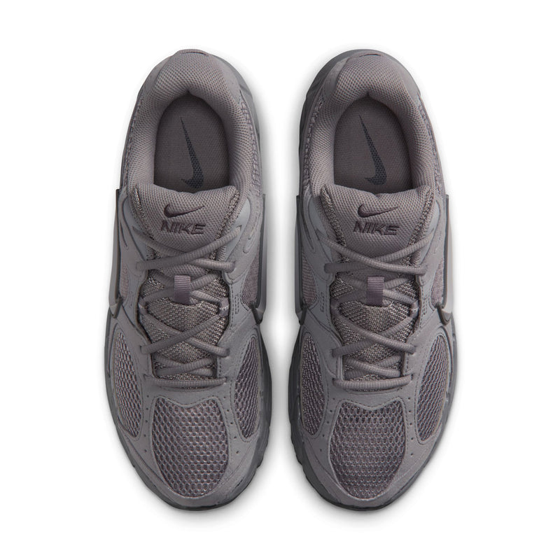 Grey mesh running shoes with lace-up front and Nike logo on the tongue.