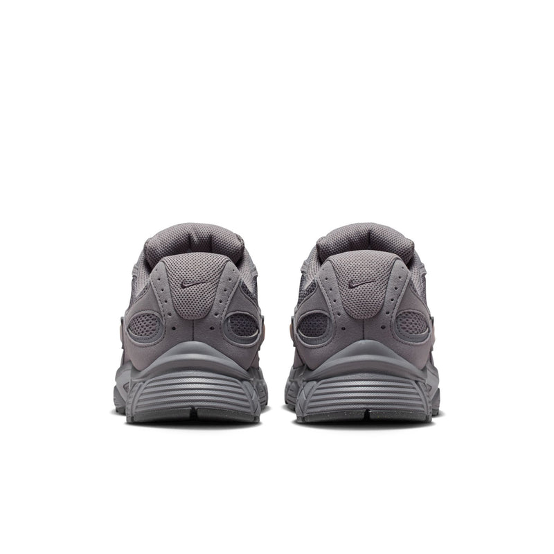 Grey running shoes from the heel view with rear tab and cushioned collar.