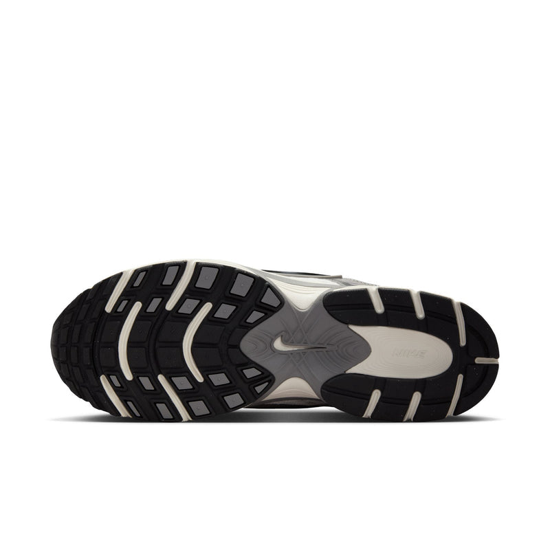 Men's athletic sneaker outsole with black tread pattern and light midfoot section
