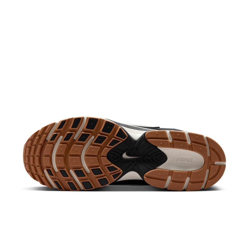 Men's black Nike running shoes, bottom view of treaded outsole with gum highlights