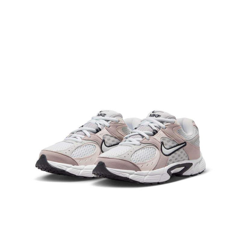 Youth sneakers pair, off-white mesh with pink panels and black Nike swooshes.