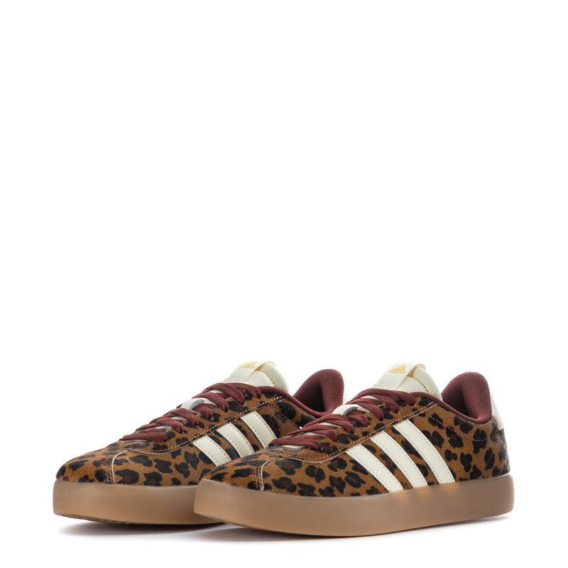 Pair of women’s low-top sneakers, leopard pony-hair upper and burgundy laces