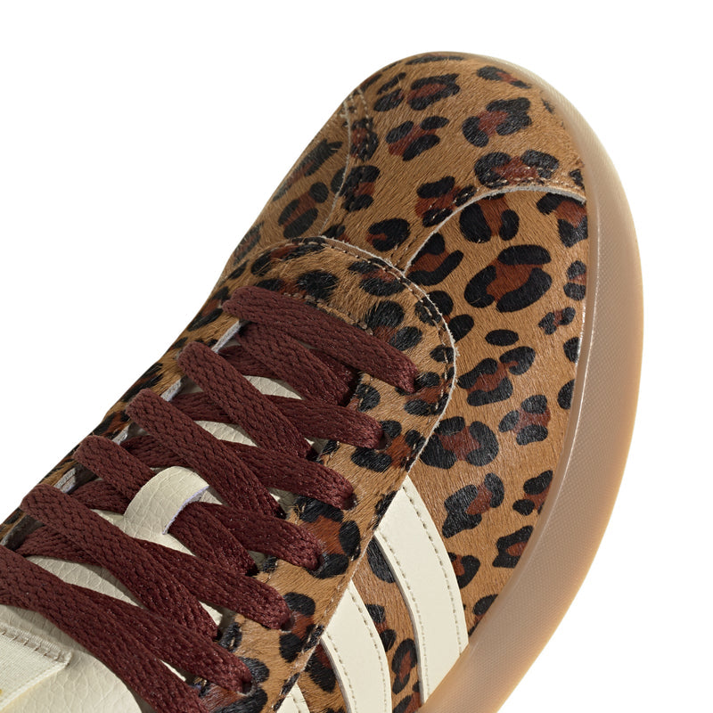Leopard-textured sneaker with white stripes and burgundy lace detail