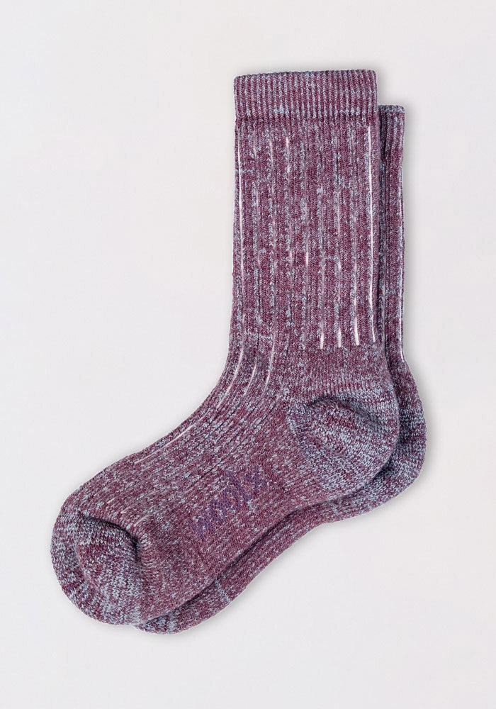 A pair of Woolx Womens Joey Crew Socks - Wildflower, featuring a ribbed texture with maroon and white speckles, are laid flat on a light background with one cozy sock slightly overlapping the other.