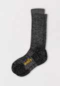 A pair of Womens Joey Mid Calf Socks by Woolx in dark navy marled, stacked together with "WOOL" in yellow on the sole, are displayed on a plain white background.