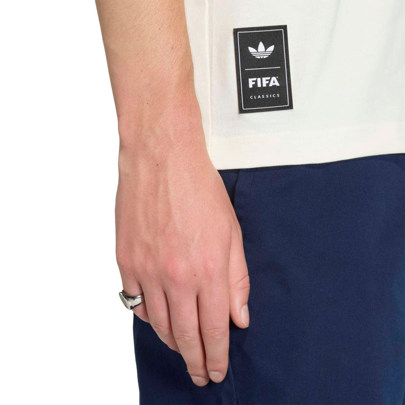Off-white T-shirt with black FIFA Classic patch near the hem