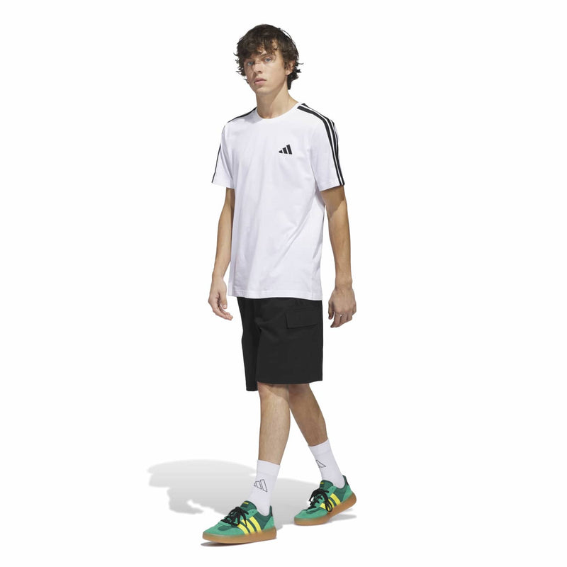 Men's black cargo shorts on model, knee-length with cargo pocket styling