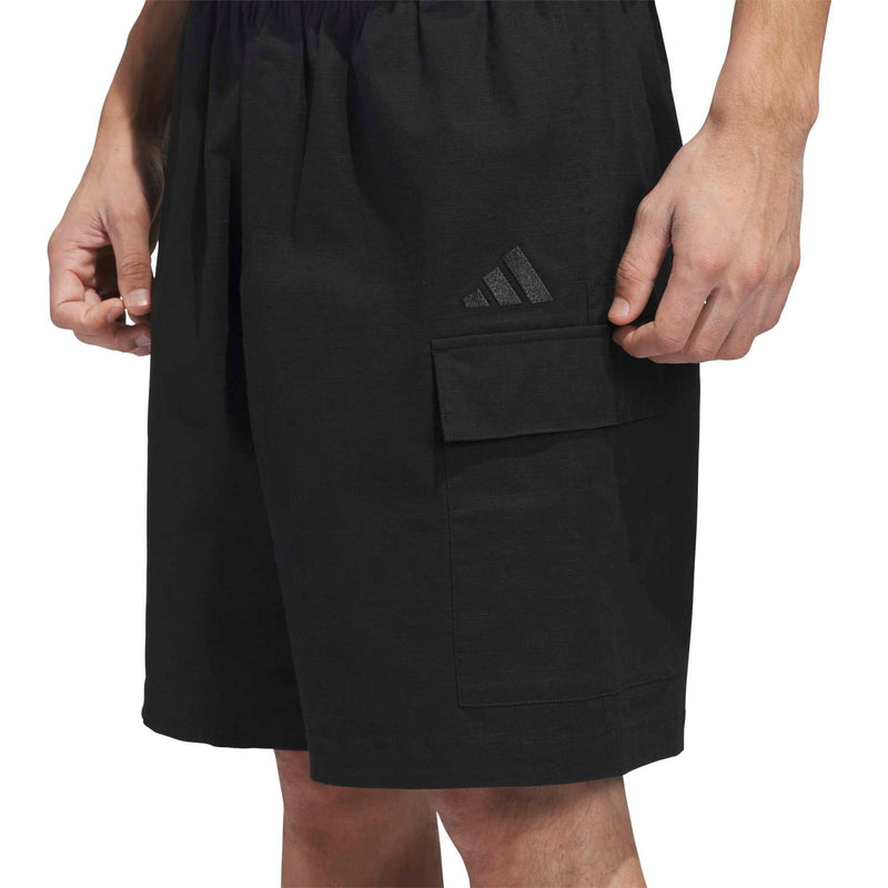 Black cargo shorts close-up of front pocket and small logo patch
