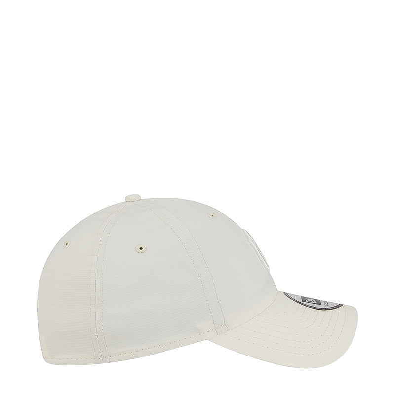 Light chrome white cap side profile with tonal logo and stitched ventilation