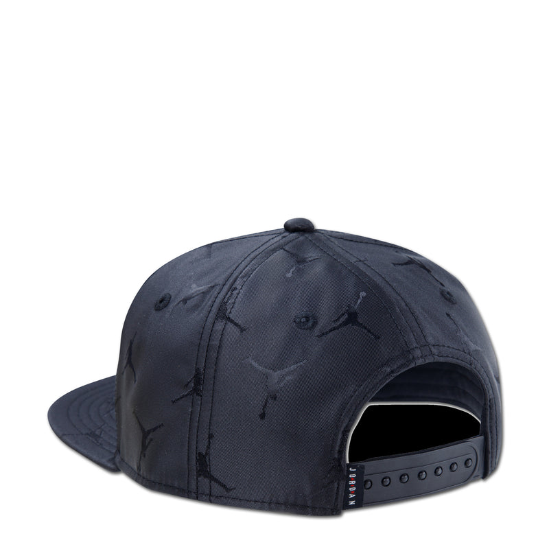 Youth black snapback cap, side view with adjustable back strap