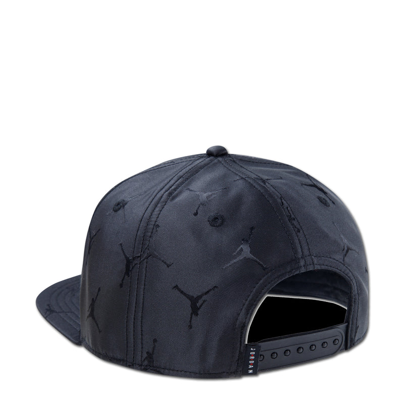 Youth black snapback cap, side view with embroidered Jumpman jacquard and open back